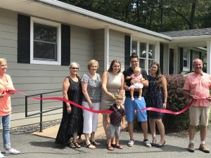 Stephanie Childs commemorates the ribbon cutting and grand opening of Summit Smiles on August 18th 2018.