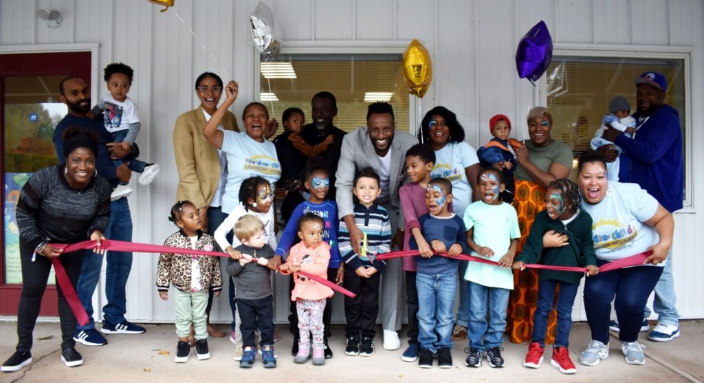 Owners Aldoric Pough and Vanessa Davison, celebrate the ribbon cutting for their new daycare.